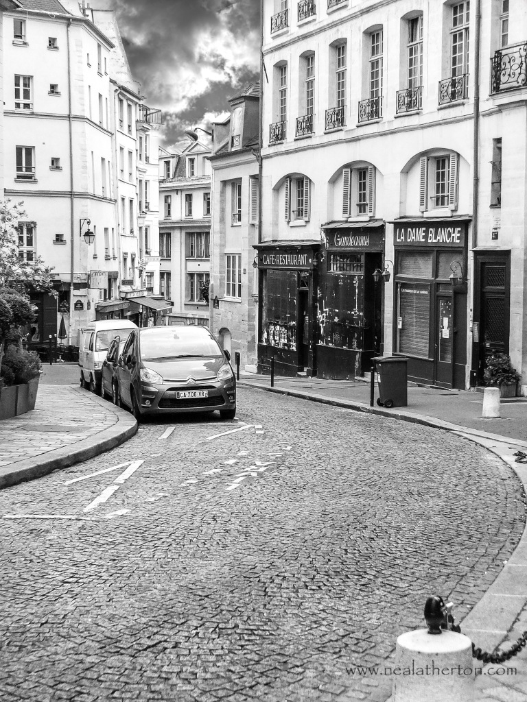 Alt="Midnight in Paris scene where Gil waits for the midnight car was filmed on Rue de la Montagne Ste Genevieve Paris France"
